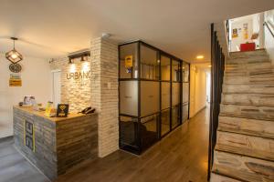 a room with a counter and a brick wall at Urbano Luxury Hotel in Pasto