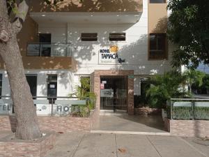 a building with a sign that reads hotel papaya at Hotel Perla Real in Santa Marta +34 photos