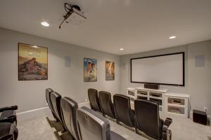 a conference room with chairs and a flat screen tv at The Kinnakeeter 107 in Avon +41 photos