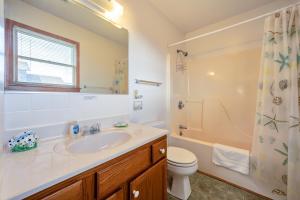 a bathroom with a sink and a toilet and a shower at Even Flow 94 in Buxton +15 photos