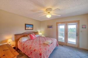 a bedroom with a bed and a ceiling fan at Dolphin Watch Avon 413 in Avon