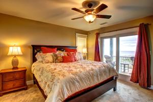 a bedroom with a bed with a ceiling fan and a window at Magic Moments 999 in Avon +36 photos