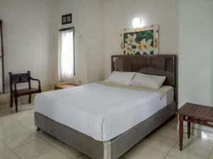 Postel nebo postele na pokoji v ubytování DATON HOUSE near Bali Zoo Ubud Mitra RedDoorz