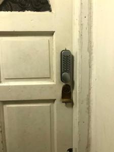 a door with a remote control attached to it at Arbnb Comfy Sleep Guest House Self Catering Private Bedrooms 60 pound per night per person in London