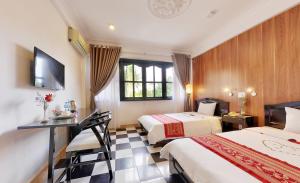 Postel nebo postele na pokoji v ubytování Hai Yen Hotel + 21 fotografií