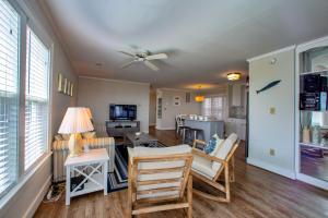 a living room with a table and chairs at Sandy's Spot 605 IC in Avon