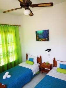Ένα ή περισσότερα κρεβάτια σε δωμάτιο στο Paraskevi Apartments