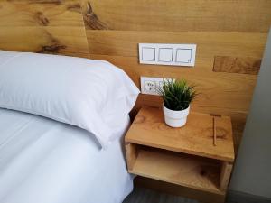Postel nebo postele na pokoji v ubytování Hotel Marqués de Aguilar