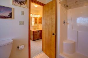 a bathroom with a toilet and a sink and a shower at Victorian Dollhouse 131 in Salvo +26 photos