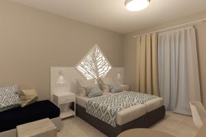 Ein Bett oder Betten in einem Zimmer der Unterkunft Likio Studios