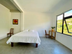 Кровать или кровати в номере Chành Rành House