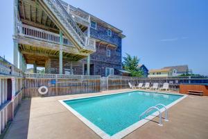 a swimming pool in front of a building at Passing Winds 741 in Salvo +28 photos
