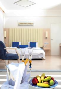 a hospital room with a bed and a plate of fruit at Vrissiana Boutique Beach Hotel in Protaras +144 photos