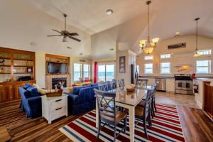 a kitchen and living room with a table and chairs at Madjoy 232 in Rodanthe