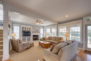a living room with two couches and a tv at Spy Dog 837 in Frisco