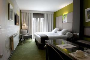 Voodi või voodid majutusasutuse Costa Esmeralda Suites toas