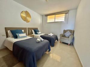 Katil atau katil-katil dalam bilik di Residencias Sol Paraiso