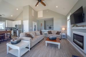 a living room with a couch and a fireplace at The Knotty Whale 120 in Rodanthe
