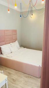 Łóżko lub łóżka w pokoju w obiekcie Apartament Towarowa Kolobrzeg