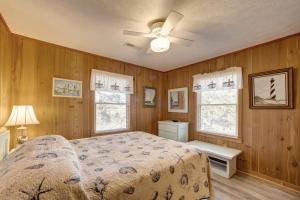 a bedroom with a bed and a ceiling fan at Cape Point 240 in Buxton