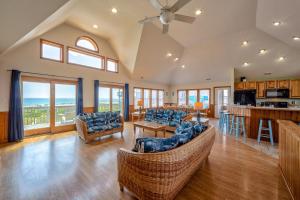 a large living room with couches and a kitchen at Beach Music 500 in Waves