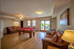 a living room with a pool table in it at Beach Music 500 in Waves