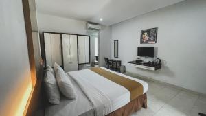 Krevet ili kreveti u jedinici u okviru objekta LPP Convention Hotel Demangan
