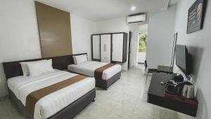 Krevet ili kreveti u jedinici u okviru objekta LPP Convention Hotel Demangan