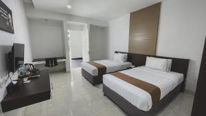 Krevet ili kreveti u jedinici u okviru objekta LPP Convention Hotel Demangan