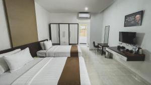 Krevet ili kreveti u jedinici u okviru objekta LPP Convention Hotel Demangan