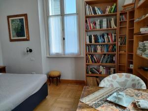 Postel nebo postele na pokoji v ubytování Villa Scalabrini