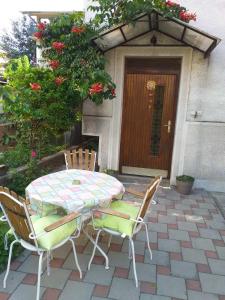 a table and chairs sitting on a patio at TILIA Apartmet in Struga +2 photos