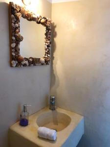 a bathroom with a sink and a mirror at Villa Molos in Molos Parou