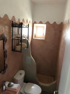 a small bathroom with a toilet and a shower at Villa Molos in Molos Parou