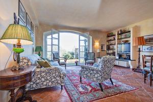 a living room with a couch and a table and chairs at Villa Dolcina luxury property in Santa Margherita Ligure in San Lorenzo della Costa