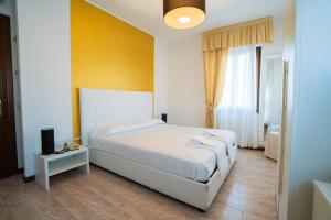 Postel nebo postele na pokoji v ubytování Hotel Sirena