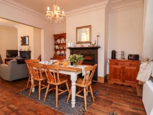 a dining room with a table and chairs at Charlotte House in Whitby