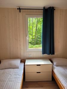 Ліжко або ліжка в номері Przystań Narie