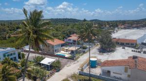 an aerial view of a town with palm trees at Casa Beira mar enseada dos golfinhos- Itamaracá in Jaguaribe