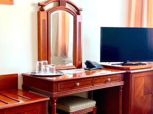 TV a/nebo společenská místnost v ubytování Hotel Bílý Beránek Kralovice