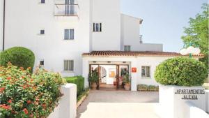 a white building with a door in front of it at Villa Allexia- APARTMENT SOL - Puerto Pollensa in Port de Pollensa