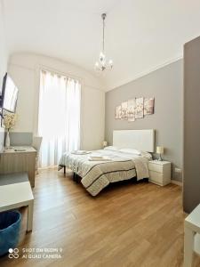 En eller flere senge i et værelse på El Dorado Vatican