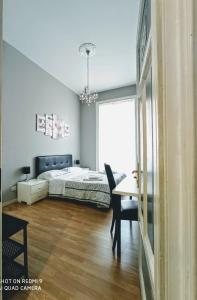 En eller flere senge i et værelse på El Dorado Vatican