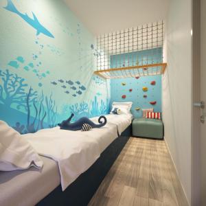 Postel nebo postele na pokoji v ubytování Falkensteiner Family Hotel Diadora