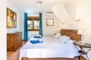 Postel nebo postele na pokoji v ubytování Casa Rosalia