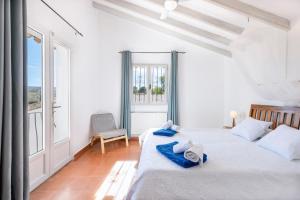 Postel nebo postele na pokoji v ubytování Casa Rosalia