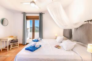 Postel nebo postele na pokoji v ubytování Casa Rosalia