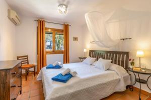 Postel nebo postele na pokoji v ubytování Casa Rosalia