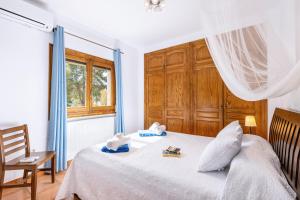 Postel nebo postele na pokoji v ubytování Casa Rosalia