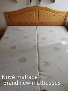 a bed with a mattress with new mattresses at Tatralandia Apartmán 341 in Liptovský Mikuláš